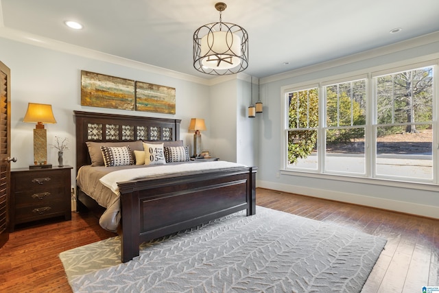 bedroom with wood-type flooring and ornamental molding