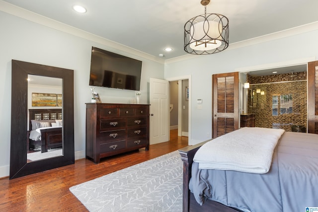 bedroom featuring crown molding and wood-type flooring