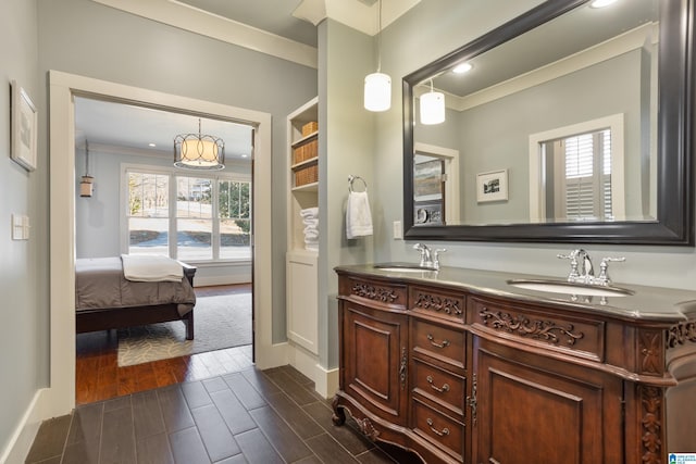 bathroom with vanity and crown molding