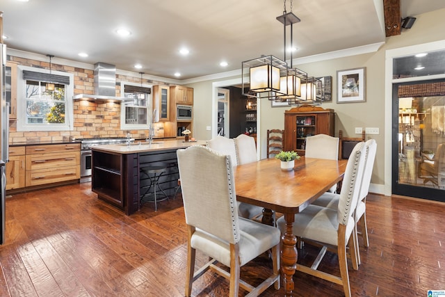 dining area featuring dark hardwood / wood-style flooring, sink, and ornamental molding