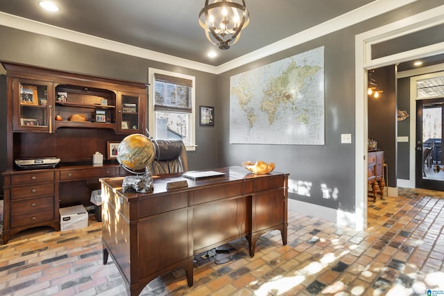 home office with crown molding and a notable chandelier