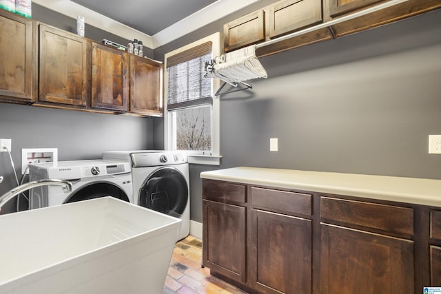 laundry area featuring cabinets and independent washer and dryer