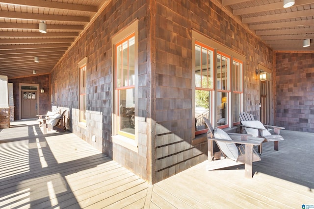 wooden deck featuring covered porch