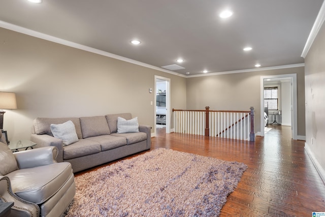 living room featuring dark hardwood / wood-style floors and ornamental molding