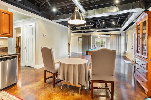 dining area with a barn door