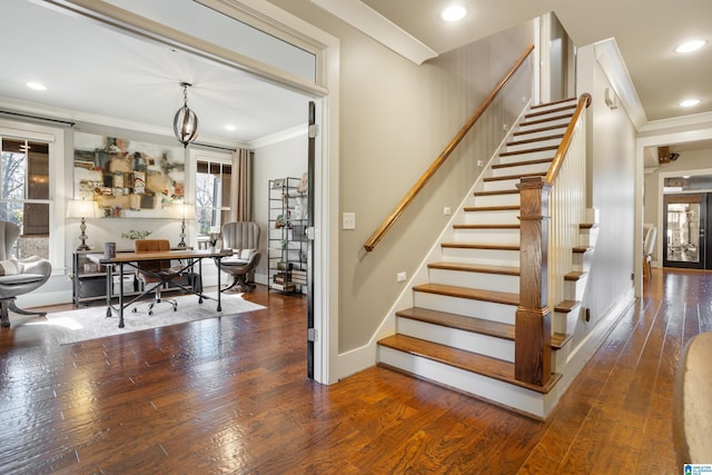 staircase featuring hardwood / wood-style flooring and crown molding