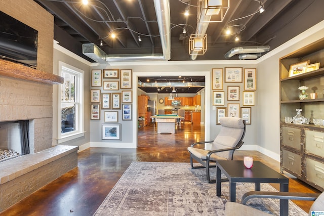 living area with billiards and a brick fireplace