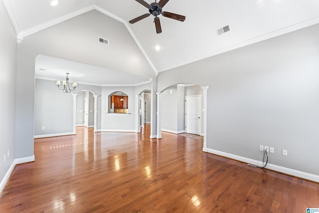 unfurnished living room with crown molding, hardwood / wood-style floors, high vaulted ceiling, and ceiling fan with notable chandelier