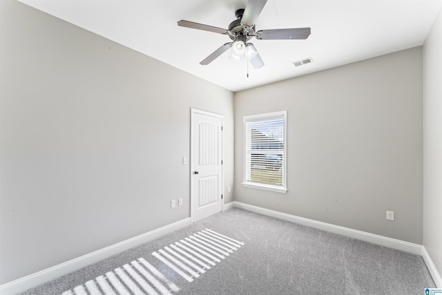 carpeted empty room with ceiling fan