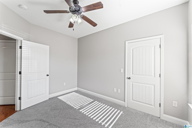 unfurnished bedroom with carpet and ceiling fan