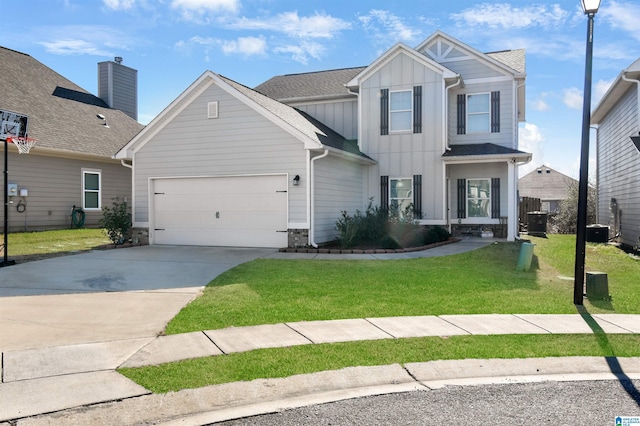 view of front of property featuring central AC, a front lawn, and a garage