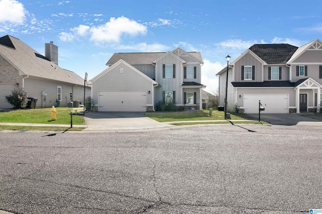 view of front facade with a front yard and a garage