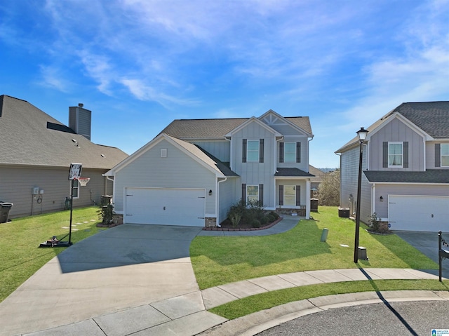 front of property featuring a front yard and a garage