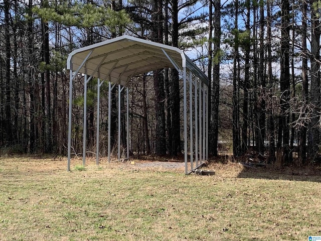 view of vehicle parking featuring a lawn and a carport