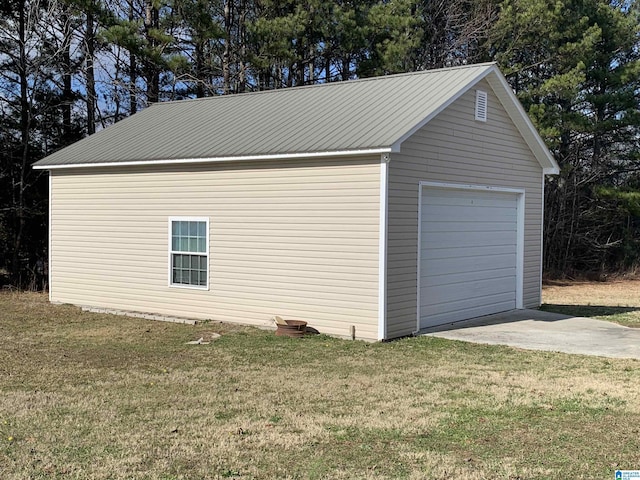 garage featuring a yard