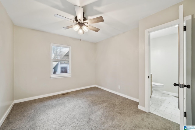 unfurnished room with carpet and ceiling fan