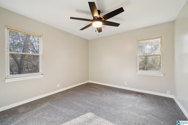 empty room featuring carpet flooring and ceiling fan