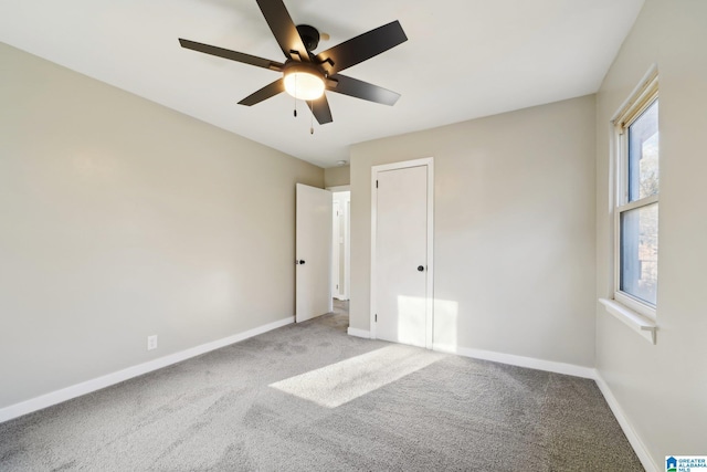 unfurnished bedroom featuring carpet and ceiling fan