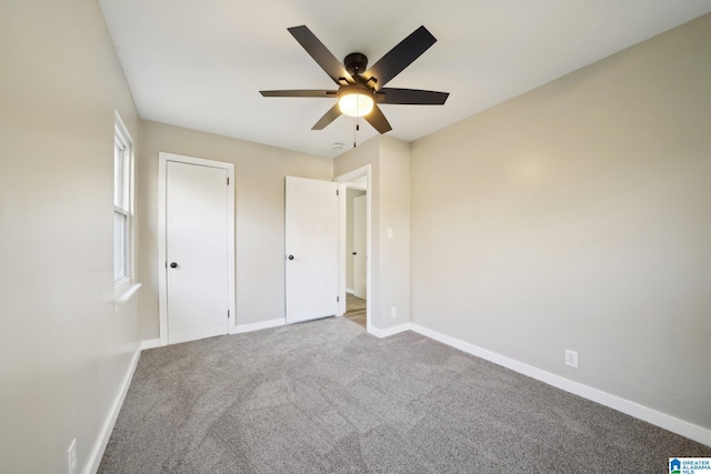 unfurnished bedroom featuring carpet and ceiling fan