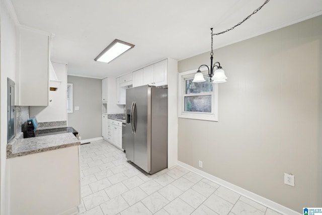 kitchen featuring stainless steel fridge with ice dispenser, a notable chandelier, stove, decorative light fixtures, and white cabinets