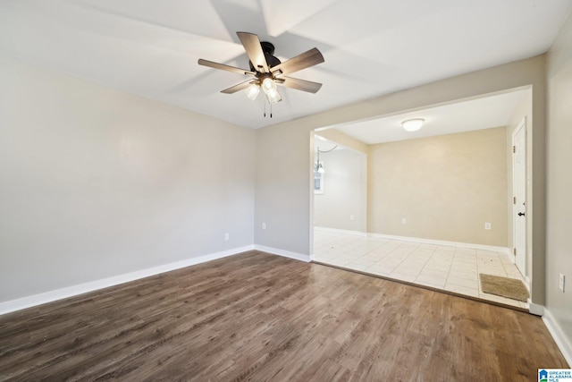 unfurnished room with hardwood / wood-style flooring and ceiling fan