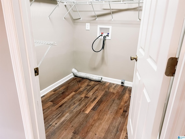 clothes washing area featuring washer hookup and dark hardwood / wood-style flooring