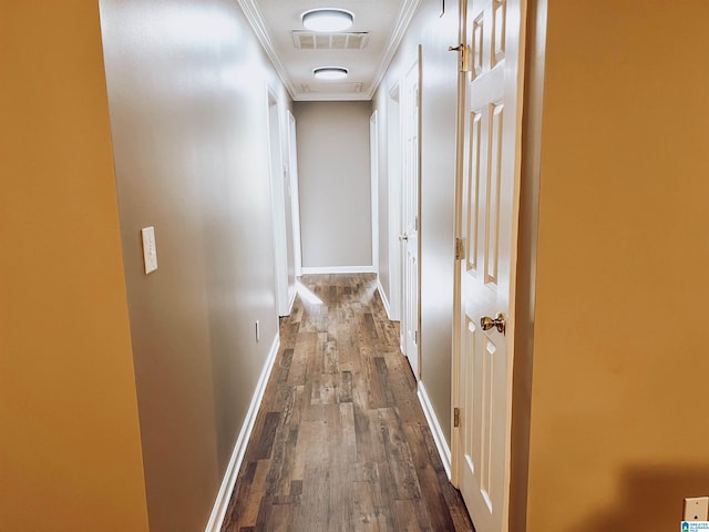 hallway featuring ornamental molding and dark wood-type flooring