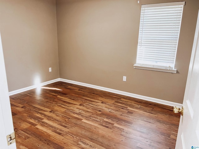 unfurnished room with hardwood / wood-style floors