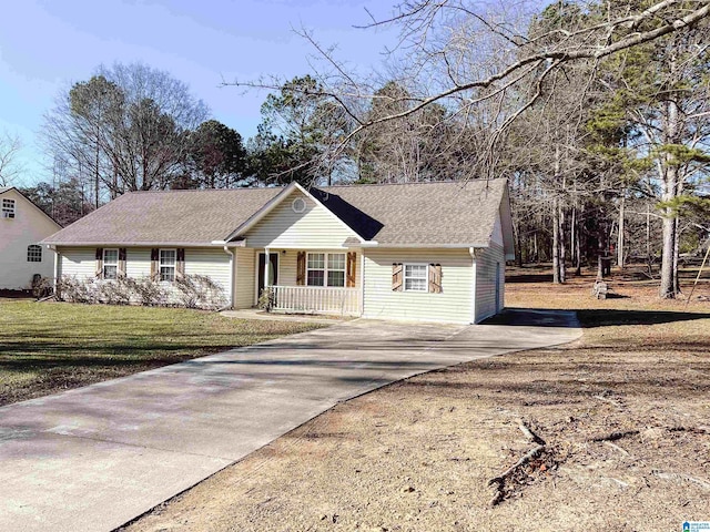 view of front of house with covered porch and a front lawn