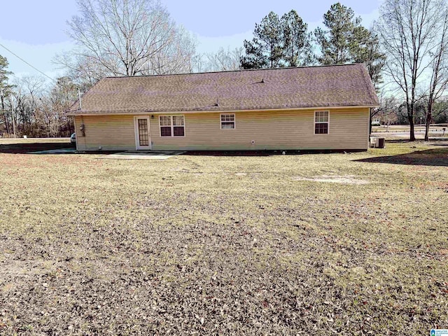 rear view of house with a lawn