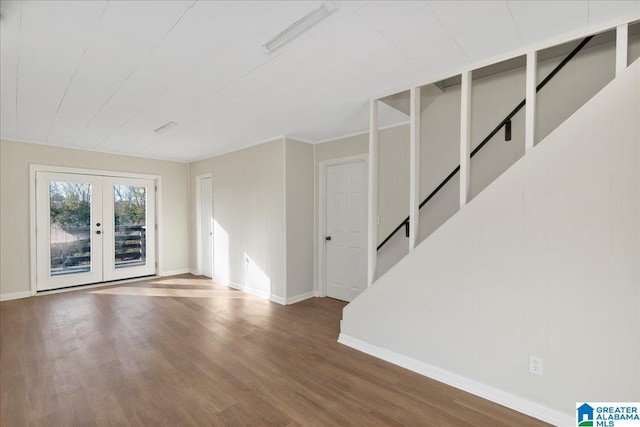 unfurnished room featuring french doors and hardwood / wood-style floors