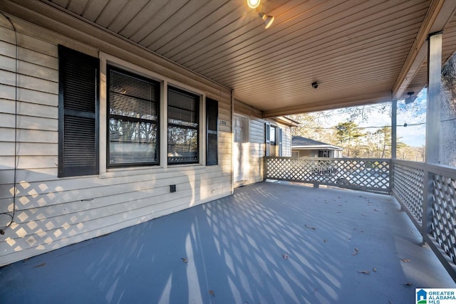 wooden deck featuring covered porch