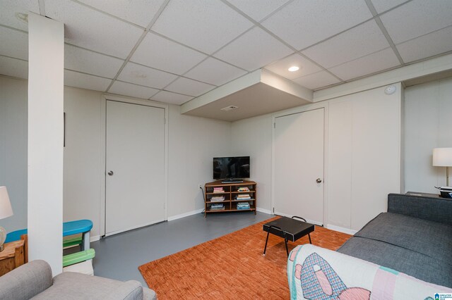 living room featuring a paneled ceiling