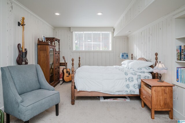 bedroom featuring light colored carpet and ornamental molding