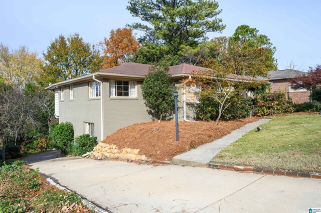 view of property exterior featuring a yard