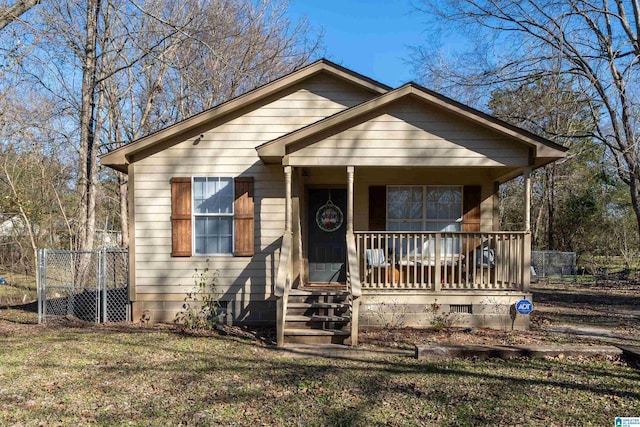 bungalow featuring a porch and a front lawn