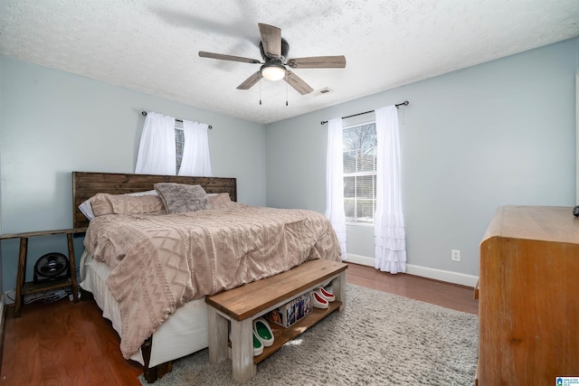 bedroom featuring a textured ceiling, hardwood / wood-style flooring, and ceiling fan