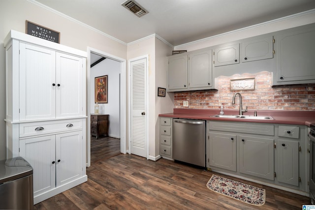 kitchen featuring dishwasher, sink, dark wood-type flooring, tasteful backsplash, and crown molding