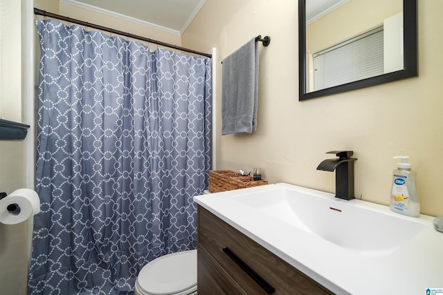 bathroom featuring vanity, toilet, and ornamental molding