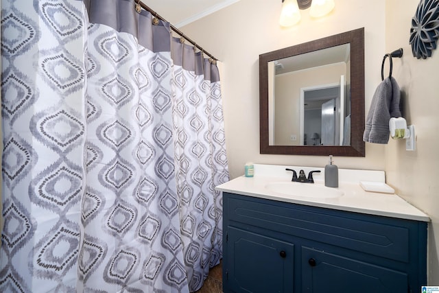 bathroom with vanity, curtained shower, and crown molding