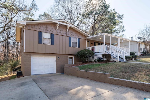 view of front of home with a porch and a garage