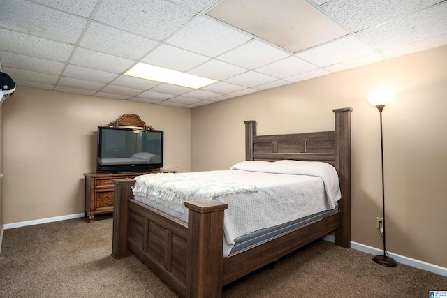 carpeted bedroom featuring a paneled ceiling