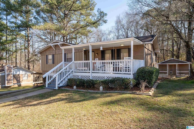 view of front facade with a front lawn and covered porch