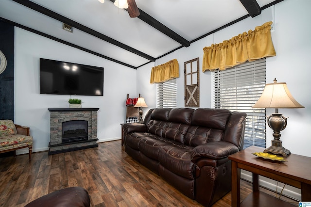 living room with a stone fireplace, ceiling fan, dark hardwood / wood-style flooring, and lofted ceiling with beams