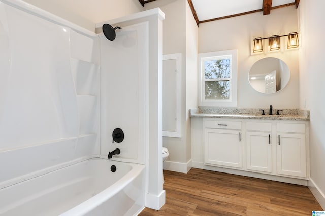 full bathroom featuring hardwood / wood-style floors, vanity, shower / bathtub combination, and toilet