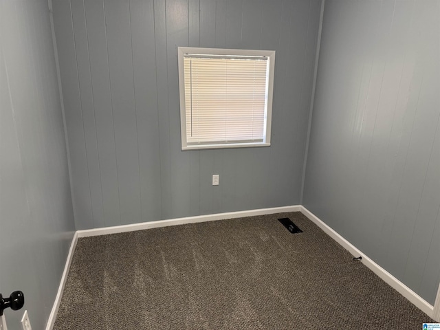 unfurnished room with carpet floors