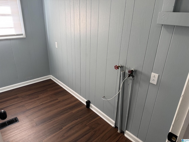 laundry room with dark hardwood / wood-style floors