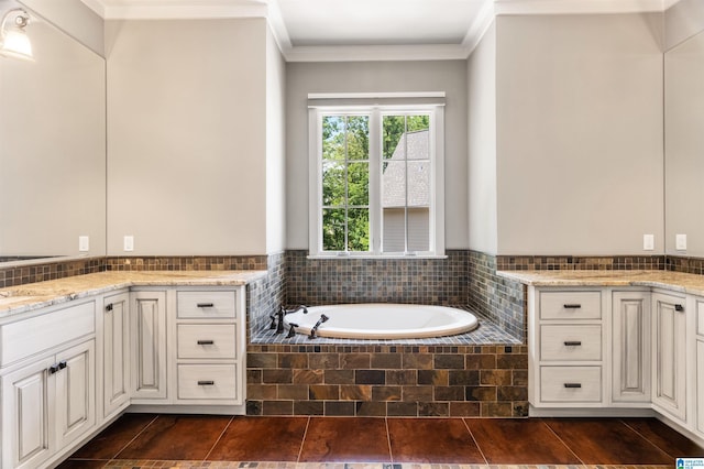 bathroom with vanity, tiled bath, and ornamental molding