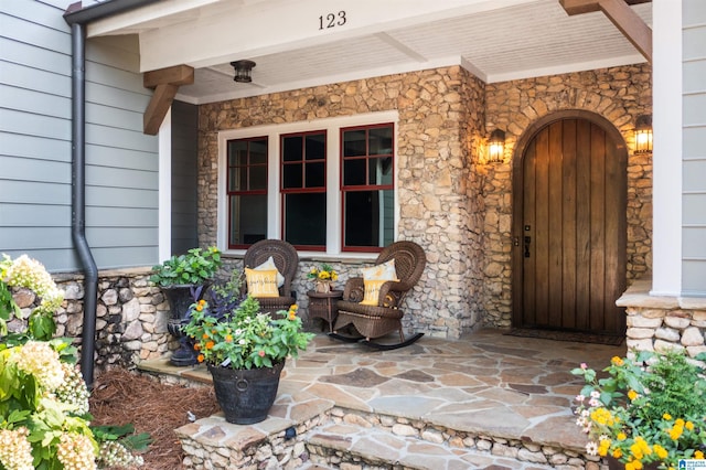 doorway to property featuring a porch