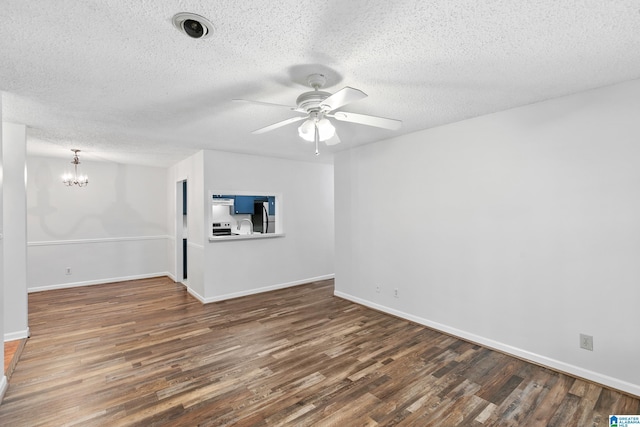 interior space featuring a textured ceiling, ceiling fan with notable chandelier, and dark hardwood / wood-style floors